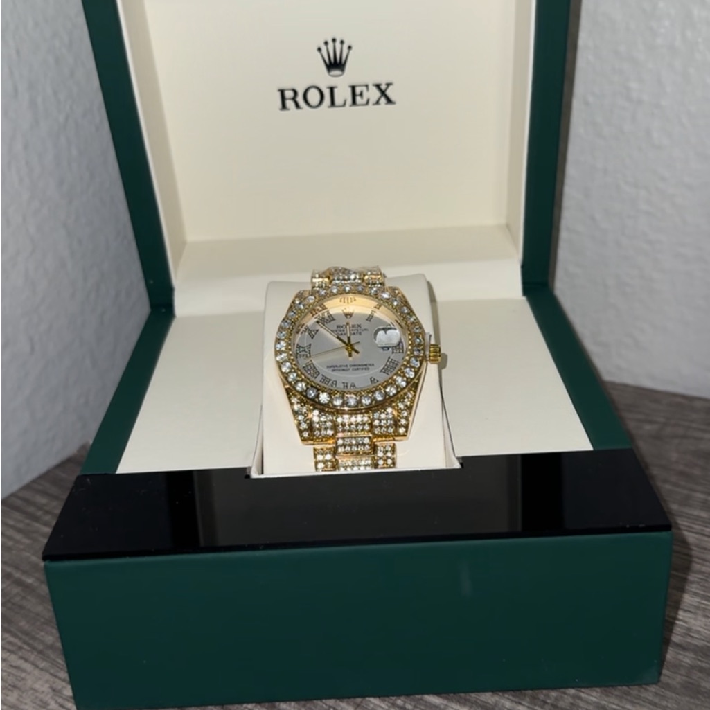 rolex gold and silver watch with diamond accents